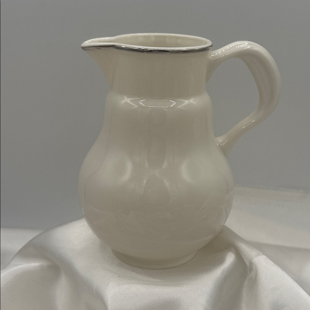 Antique Lenox china jug/creamer in creme color with platinum trim.